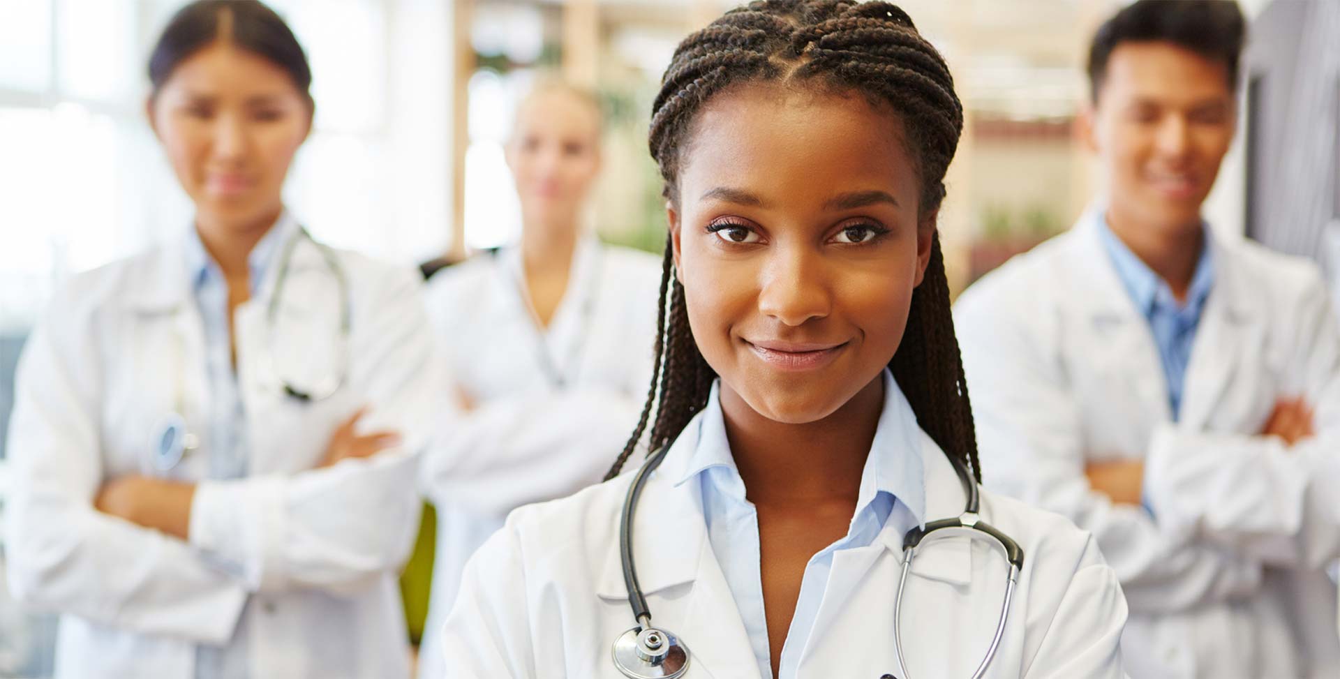 doctors standing with arms crossed